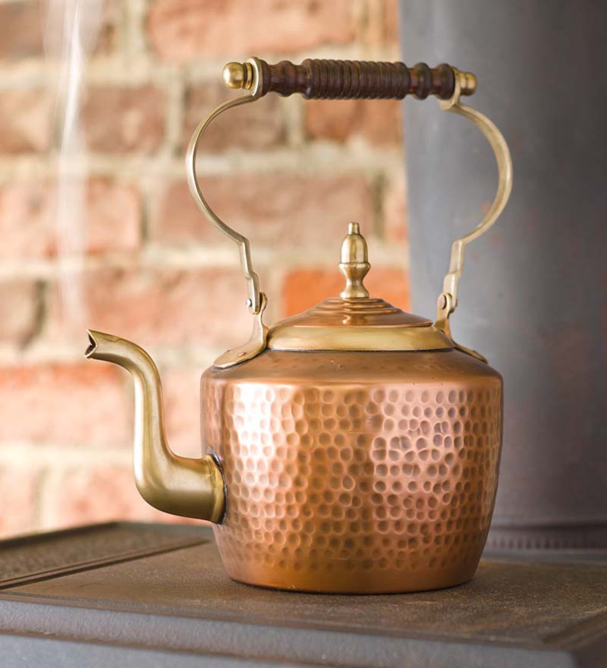 vintage enamel kettle On the wood-burning stove in the morning