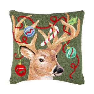 A deer with christmas lights hand-hooked Christmas pillow