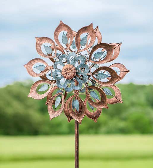 A Copper Lily Wind Spinner Garden Stake 