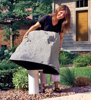 Image of a faux Mock Rock being placed over a utility box. Shop Faux Rocks & Privacy Screens