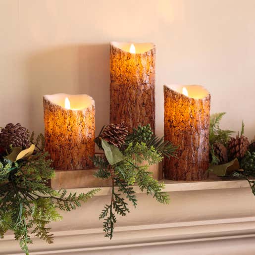 Image of Flameless Woodland Pillar Candles. Shop Christmas Lighting