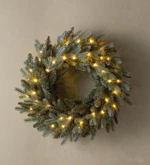 A pre-lit Misty Pine Wreath with warm white lights